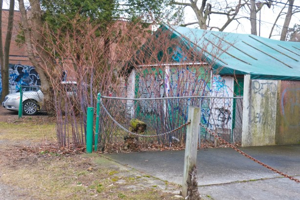 parking space in alley with chain across it, garage, 