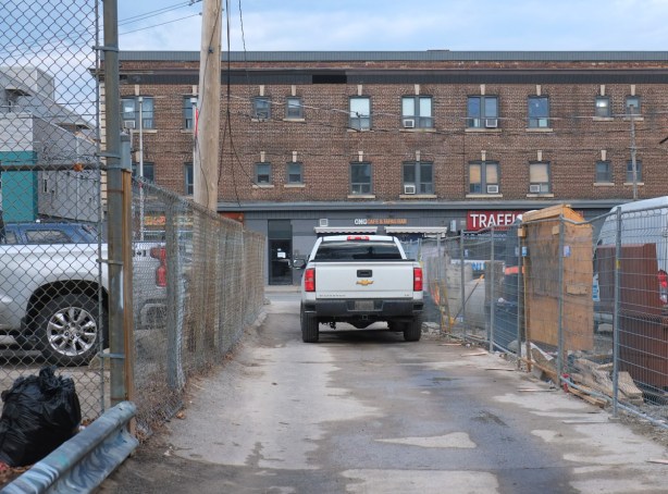 whit truck parked in a lane with construction on both sides, on dovercourt, just north of bloor