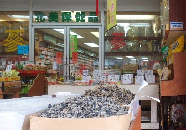 chinese food store on spadina, with some items on display on the sidewalk