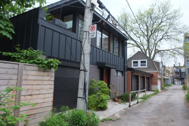 infill housing in a laneway, two storey house with mostly windows on upper level