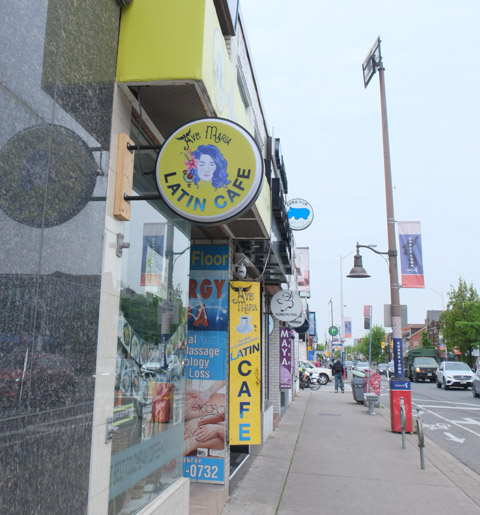 Latin Cafe on Bloor with round yellow sign,