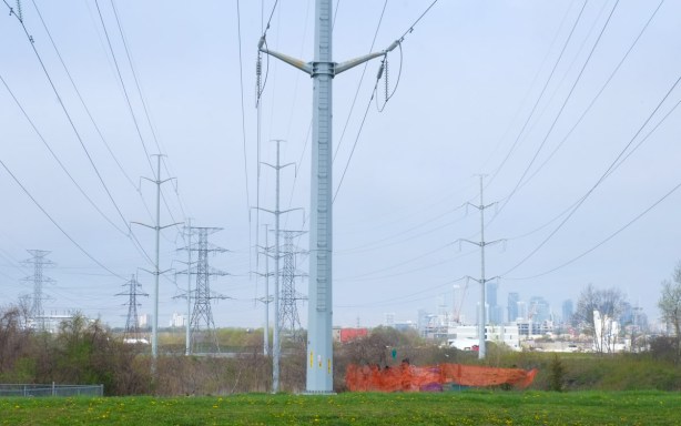 many tall metal hydro poles on right of way