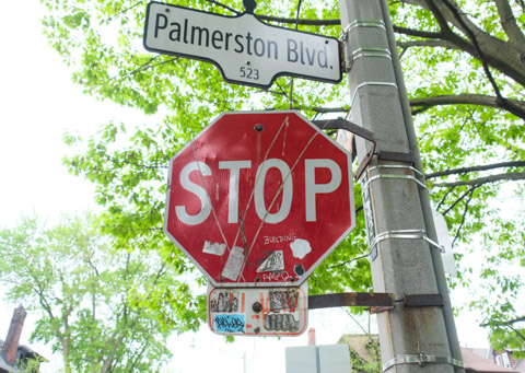 stop sign at Palmeston Blvd, with the word building scratched into it, stop building
