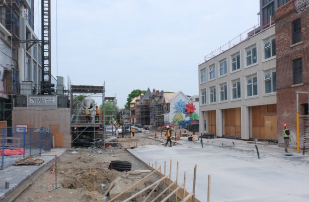 workmen on construction site on Markham street