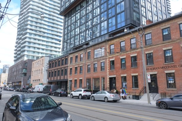 older brick buildings whose facades were saved when redeveloped and condos built on top