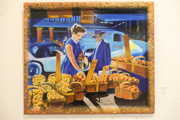 artwork on the wall of Gallery 1313, painting in mostly blues and golds, of a woman looking a baskets of peaches for sale at a fruit and vegetable market, sidewalk, by Steve Schnier