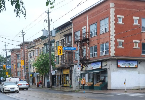queen street west, south side of street, west of jameson, row of three storey brick buildings, stores, 