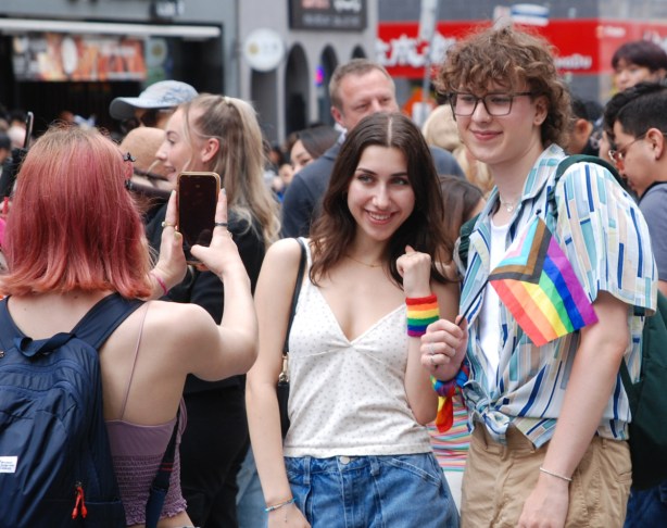 couple posing for photo at pride parade