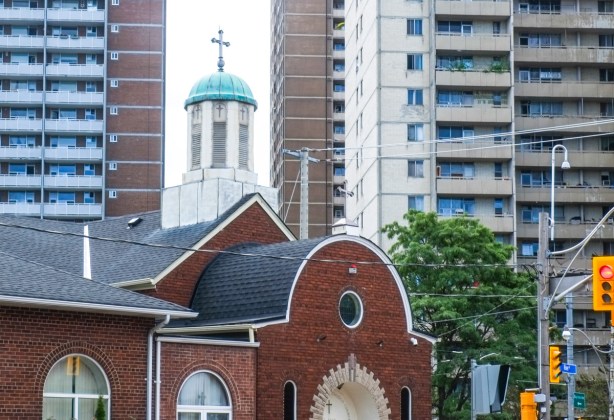 St. Sava, Serbian Orthodox Church at Gerrard and River, with tall apartment buildings behind