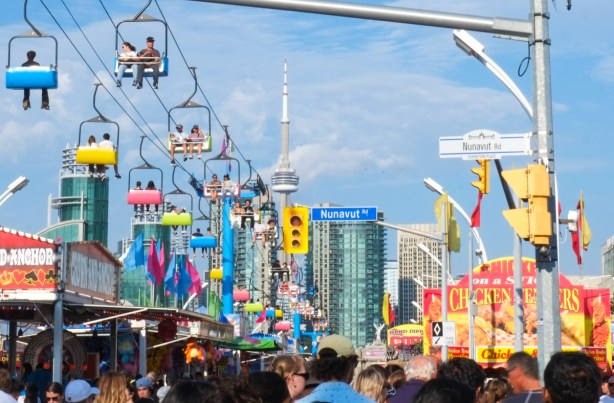 view of midway from Nunavut Dr, with CN Tower in the distance
