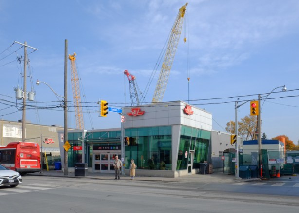 pape subway station entrance on pape avenue, with cranes around it, for construction of Ontario Line