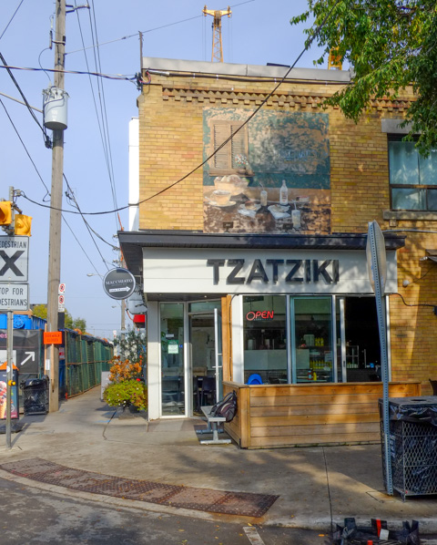 Tzatziki restaurant cafe on Pape, with painting above entrance