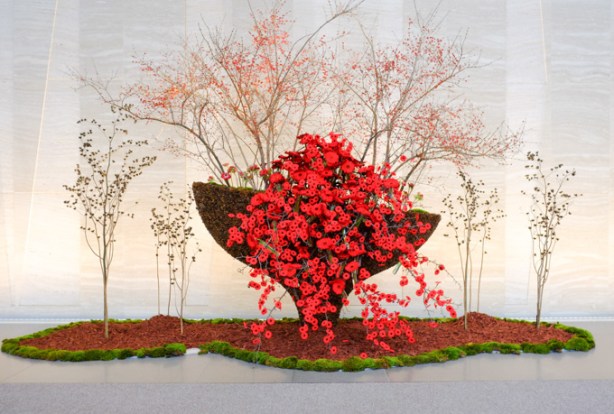 an arrangement of red poppies for Remembrance day in the lobby of an office building, 