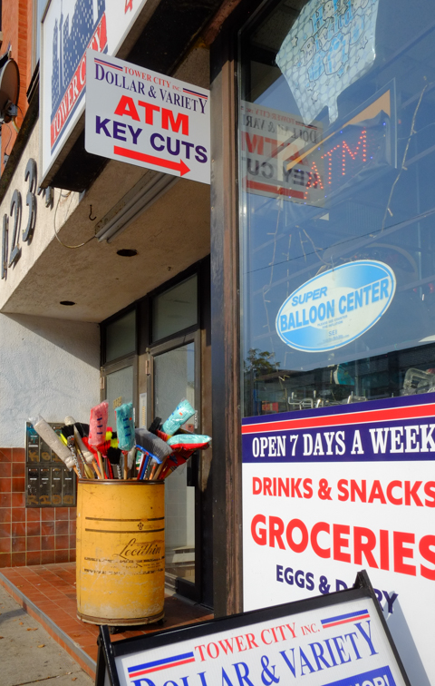 jumble of signs outside of a store