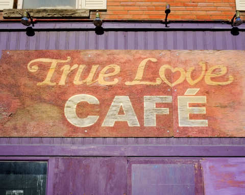 sign on True Love Cafe, a bright purple building