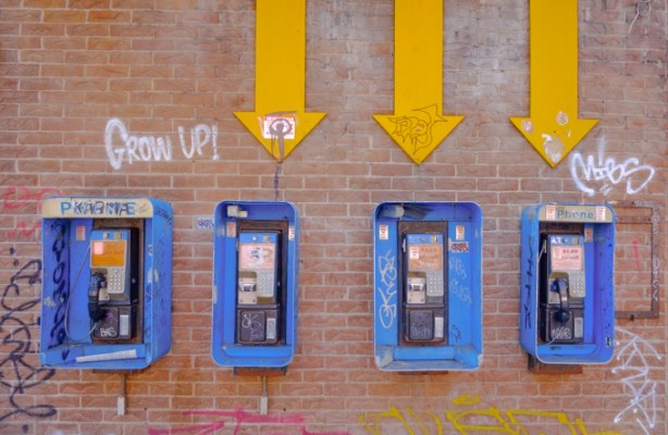 exterior of front of hair salon with pictures of men and women with their hair cut