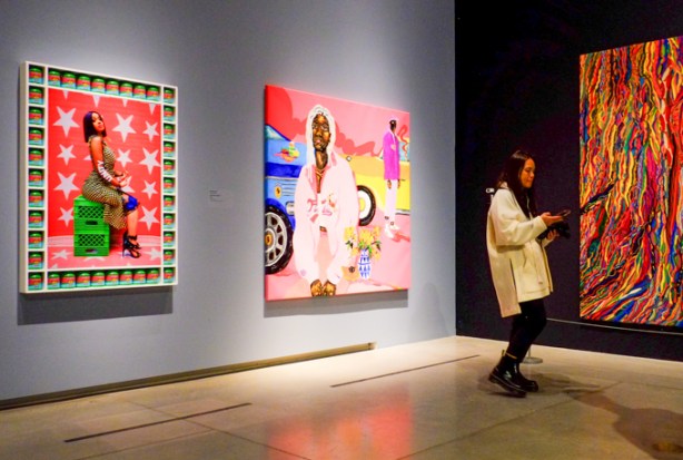 a woman looking at pictures at the Art Gallery of Ontario