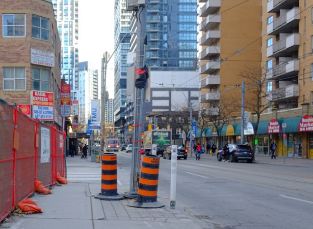 looking east along dundas from dalhousie street, construction traffic cones, tall buildings,
