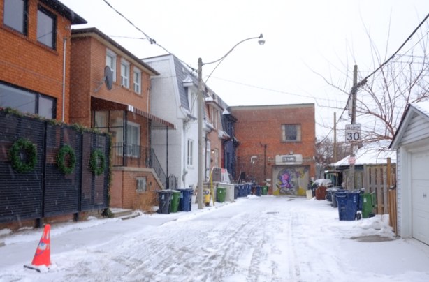 federal street, south end, houses on left side, backyards of parallel street on the right, garages in front of fences