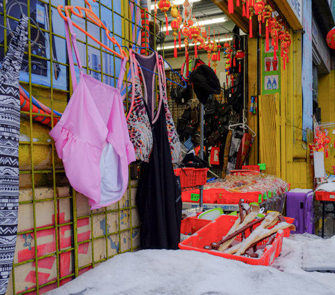 front of a store in chinatown, goods on display outside