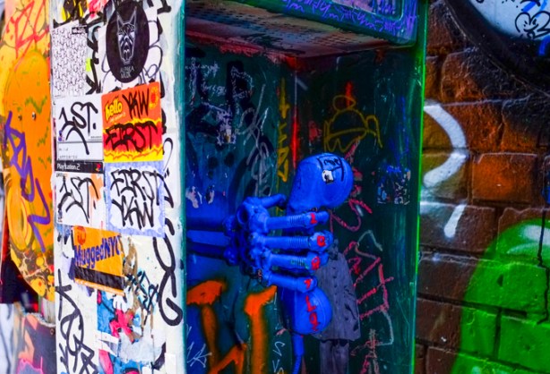 old telephone booth in graffiti alley