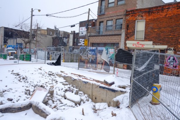 fence around vacant lot, now construction site at lane and Dufferin, also at Boland Lane