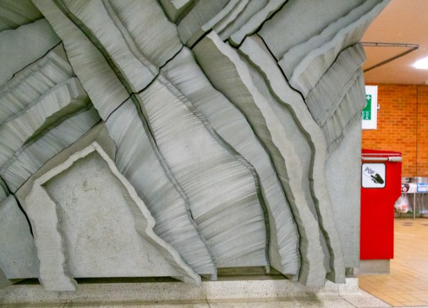 very textural wall sculpture by artist ted bieler, called canyons, inside wilson subway station