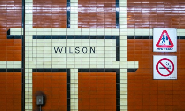 tiles, interior walls of wilson subway station, design of vertical and horizontal lines in pale yellow on rust coloured background