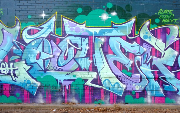 throw up tag calligraphy street art, light blue and light purple letters on purple and green background