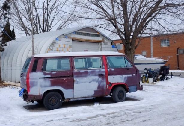 old purple van with patchy bodywork
