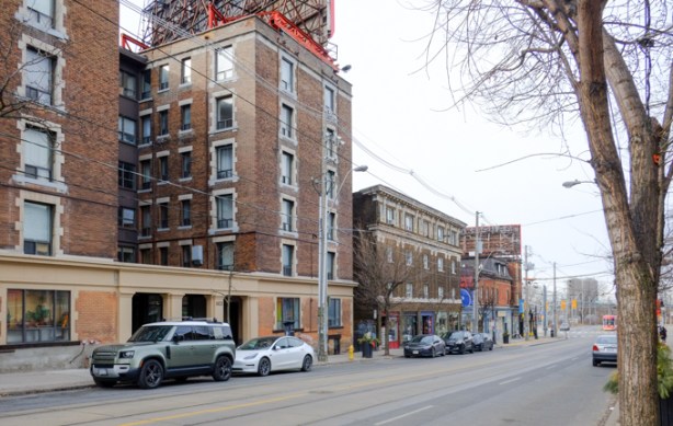 brick buildings, low rise apartments, on south side of queen, near roncesvalles