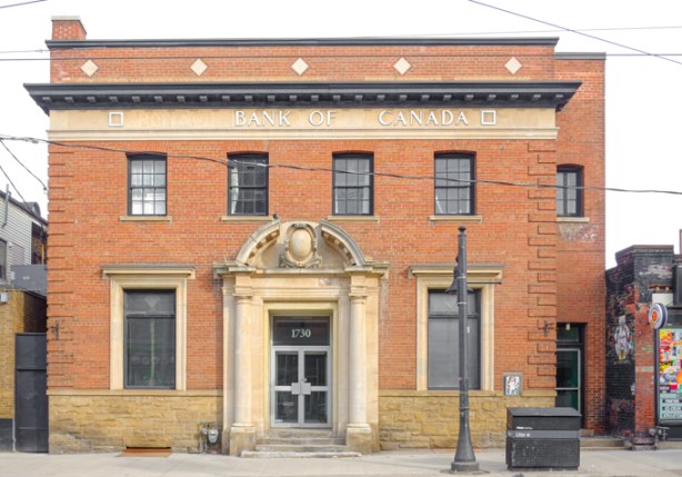 old royal bank of canada building, red brick, with stone dorway, including arch over door