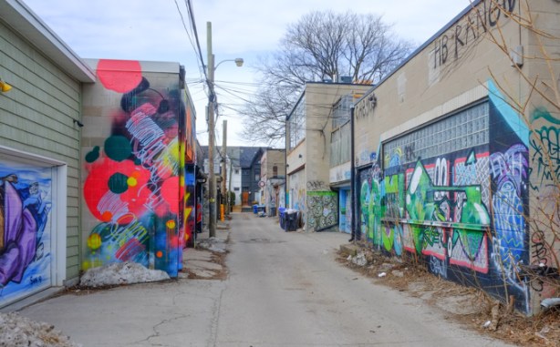 alley behind ossington, on the west side, garages covered in street art and graffiti
