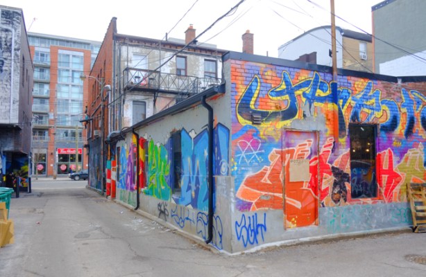 building in an alley, northeast corner of queen west and ossington, street art and graffiti on the walls