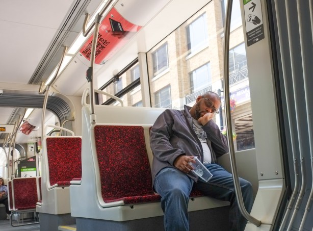 man sleeping on a TTC streetcar