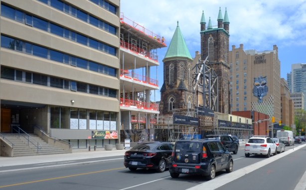 looking east on Bloor street, north side of street, traffic, new construction, church being turned into condos, 