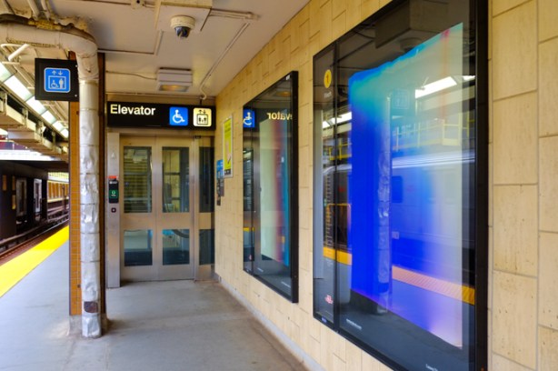 Two images by Laure Tiberghein, behind glass, by exit from Davisville station platform