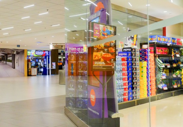 lower level of college park, outside glass wall of grocery store