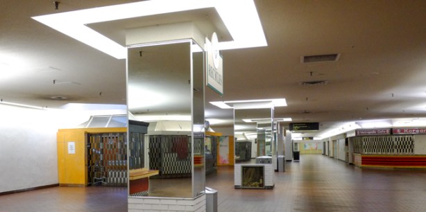 the basement level of cumberland terrace, with lots of mirrors and square ceiling lights, but no people, mostly closed