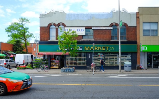two storey brick building on bloor, market on lower level, language school, CCLCS, on the upper. roofline has two little wave-like curly features