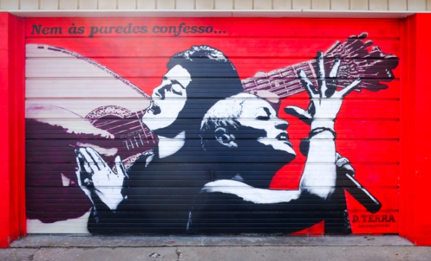 mural on red background, musicians, one singer and one instrument player