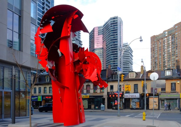 red metal sculpture on the corner of Yonge & Gloucester