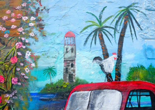 white chicken on the roof of an old red truck, part of a mural of nature scenes by B C Johnson in Gloucester Place 