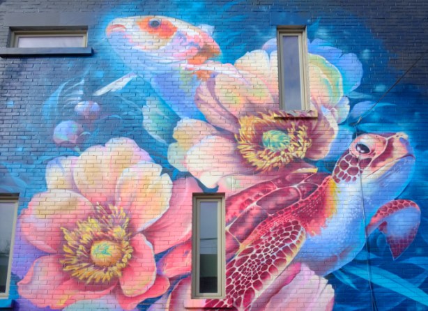 mural, pink flowers, a fish, and a sea turtle