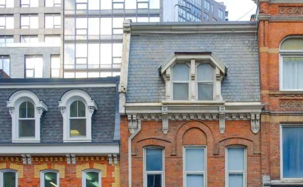 upper storeys of old brick buildings on Yonge Street
