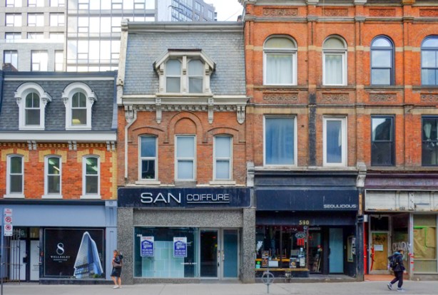 old brick buildings on Yonge, north of Wellesley, west side of the street, three storeys high, most from the 1880s, san coiffure, 