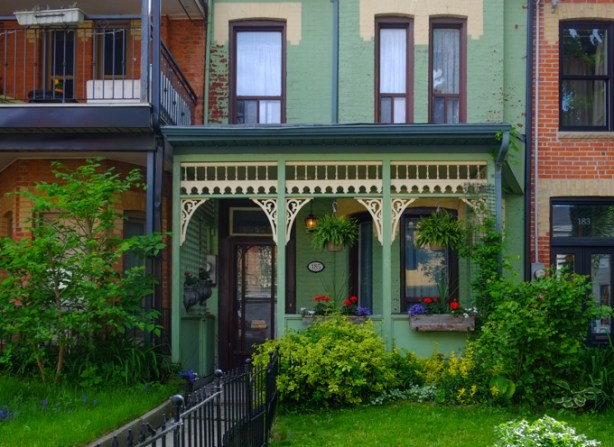 green house with elaborately decorated front porch