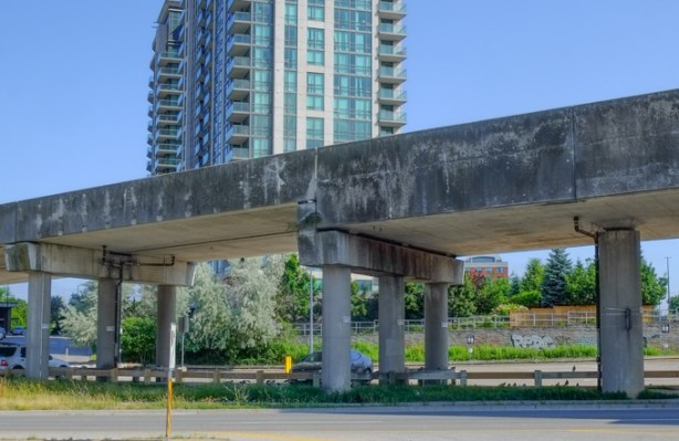 elevated tracks for old scarborough srt, in front of a tall condo building