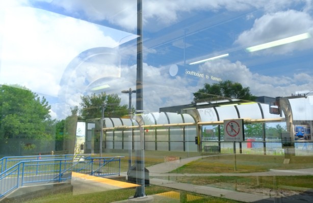 looking in window of ellesmere srt station, reflections, sign saying southbound to kennedy