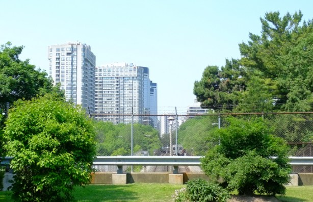 looking west from Montgomery Road towards high rises near Islington, TTC subway tracks in the image as well